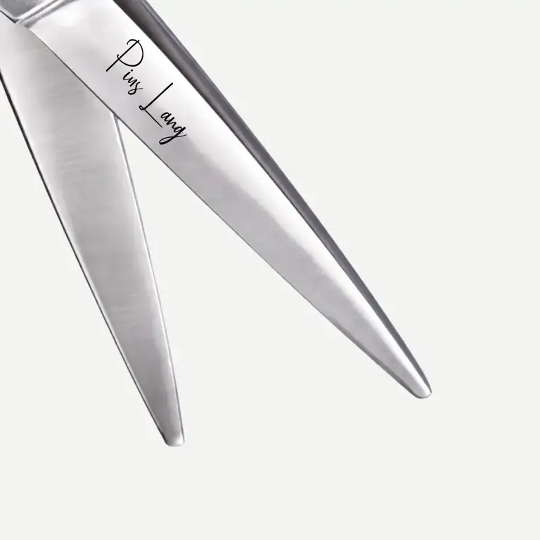 Close-up of PIUS LANG scissors blade edge, showing precision convex grinding